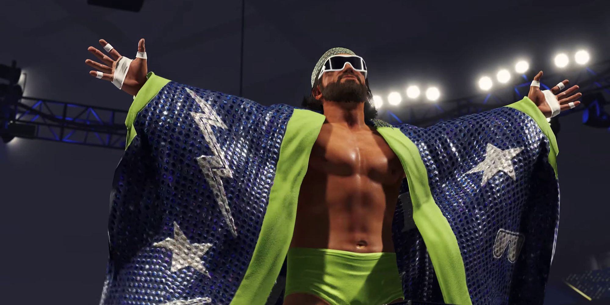 Macho Man Randy Savage stands with arms outstretched during the WWE 2K23 trailer, wearing green shorts and a shiny purple cape embellished with stars