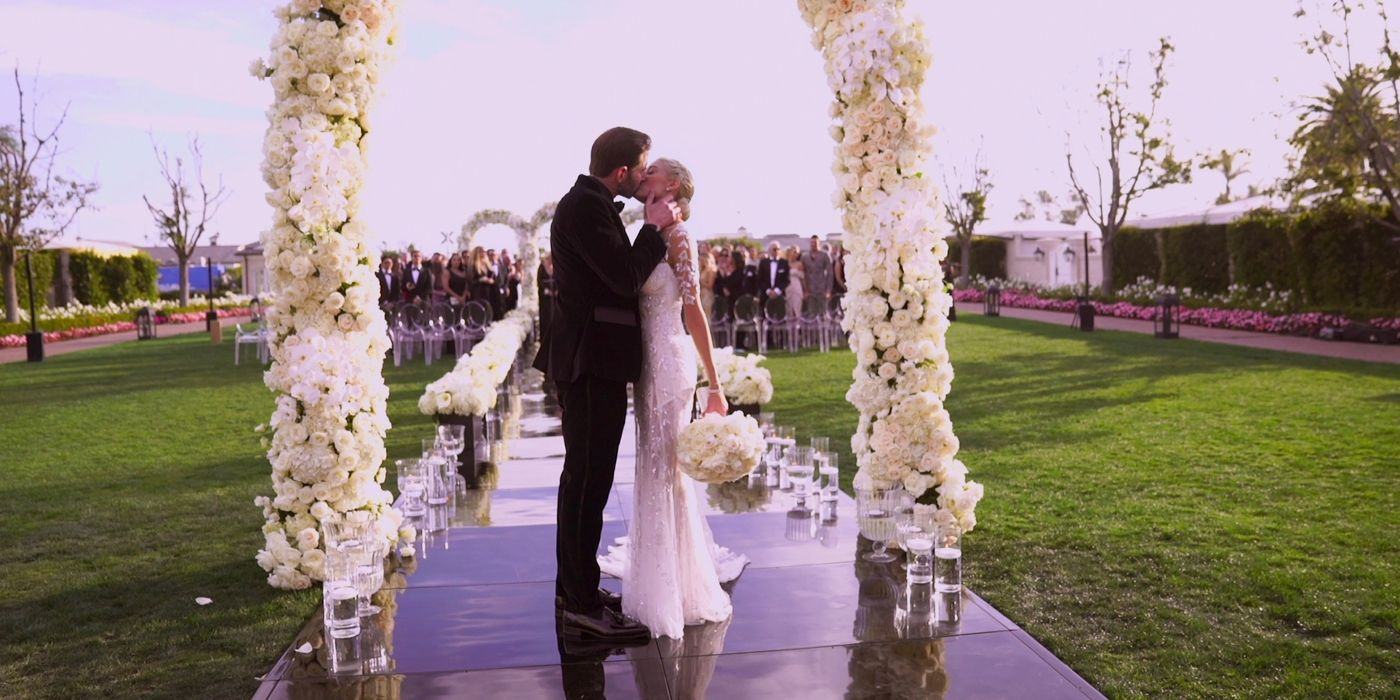 Tarek and Heather El Moussa kiss at Sell Sunset on their wedding day