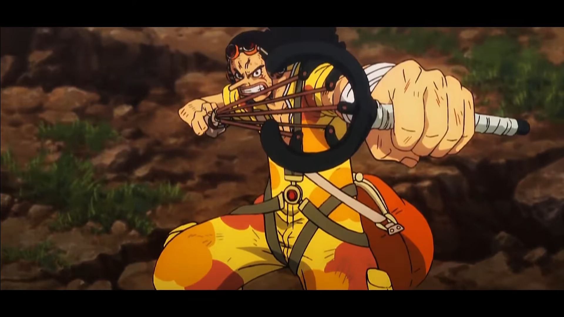 The battered Usopp can be seen aiming his slingshot at the camera in the movie One Piece One Piece.