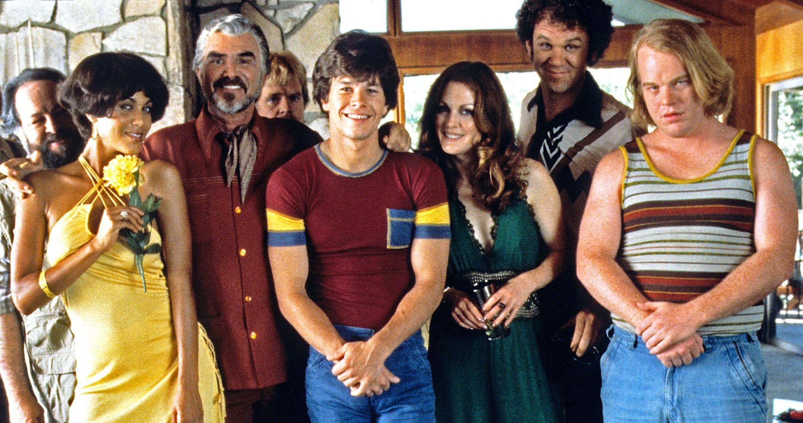 The cast of Boogie Nights all dressed in 70s gear