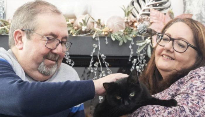 Couple claim the 'lucky' black cat they rescued helped them win £1,000,000