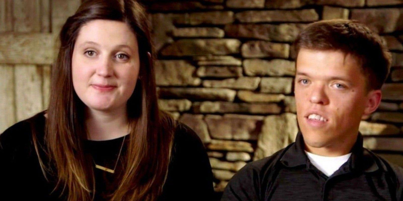 Zach and Tori Roloff from Little People, Big World posing in front of brick wall