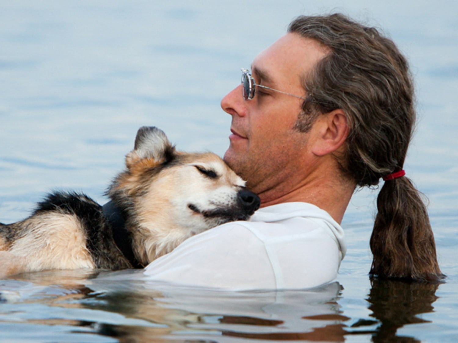 Man takes his sick dog to the lake to ease the pain