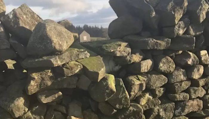 You will be surprised to see a large plate stuck in the stone wall as you walk