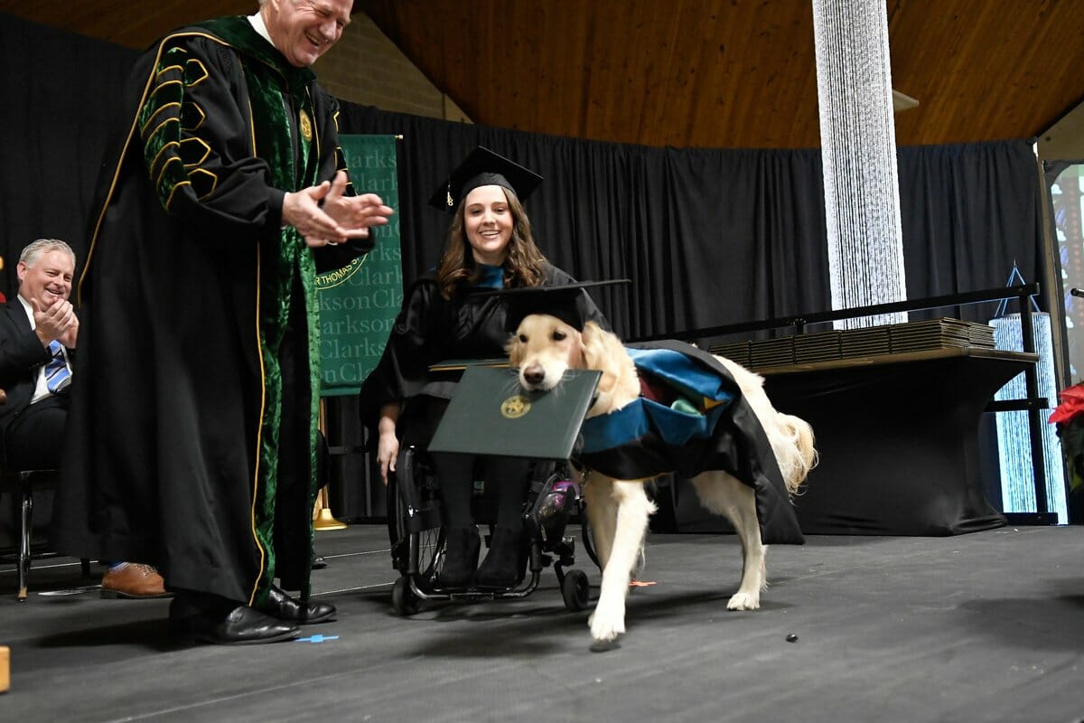 Good boy.  Loyal service dog receives honorary degree for helping owner graduate