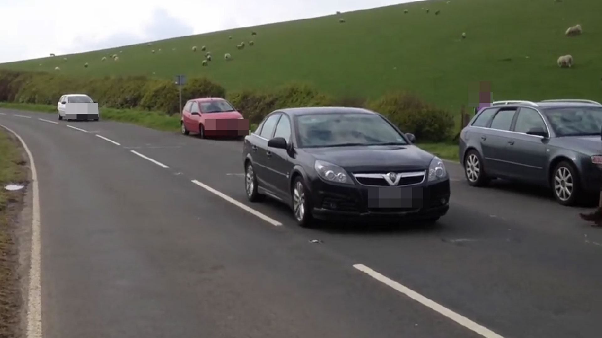 Mind-bending optical illusion shows cars rolling UPHILL in bizarre ‘magnet trick’ – can you work it out?