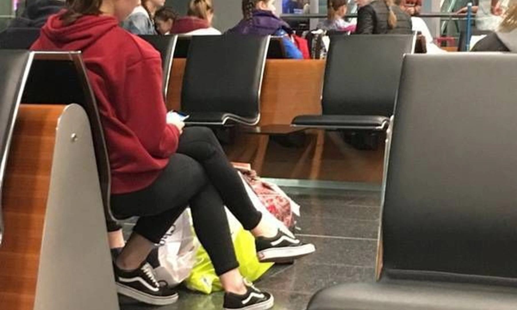 Mind boggling optical illusion shows woman with three legs at airport - can you work out what is really going on?