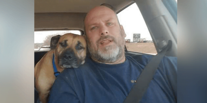 The kind man left the car at the pump, the dog jumped on the car and wanted to hug it