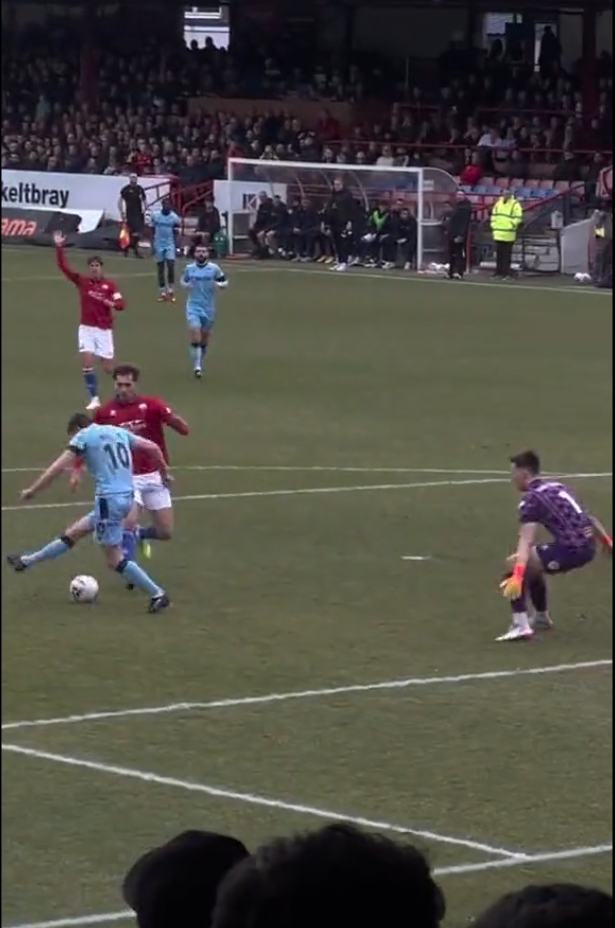 Wrexham star Paul Mullin scores a bizarre optical illusion goal... but there's a simple explanation