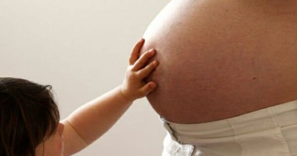 A pregnant woman has passed the virus to her baby, say French doctors