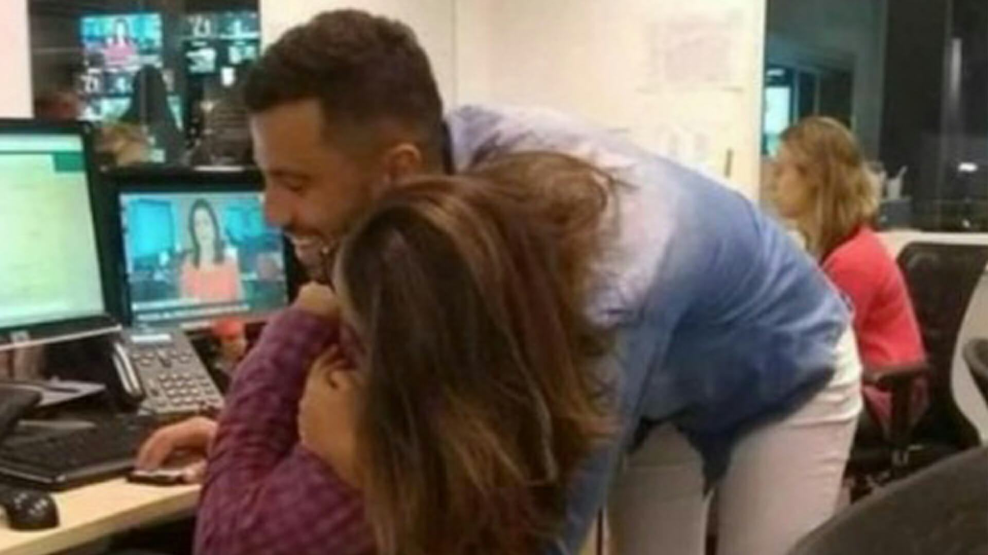 Mind-bending optical illusion appears to show two co-workers hugging – can you work out what's actually going on?