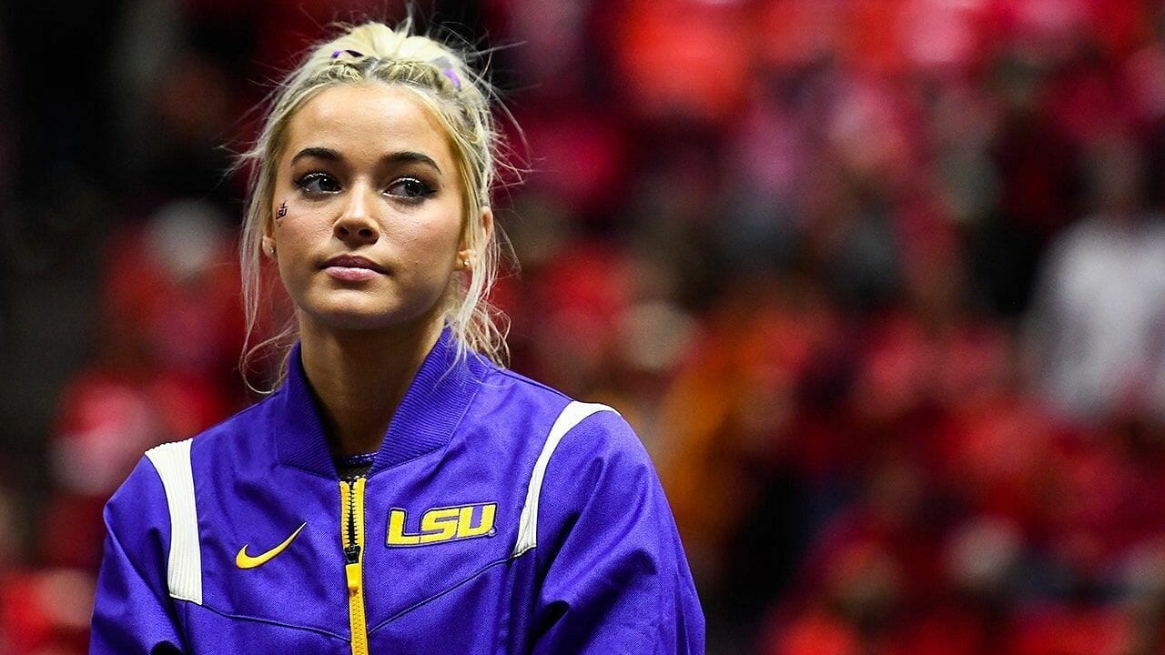 Social media users share wild and hilarious responses as the gymnast revealed that she does not attend in-person classes at college. (Image via Getty Images)