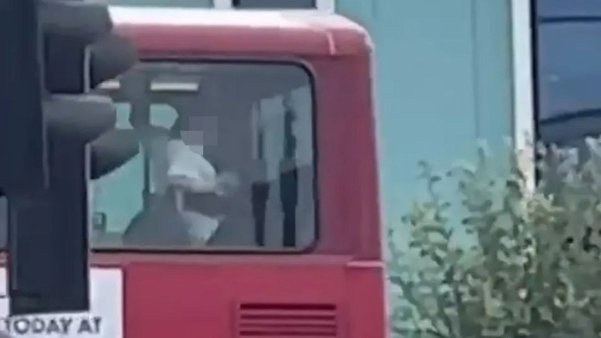 Shocking moment couple 'have sex on top deck of double decker bus' in front of members of the public