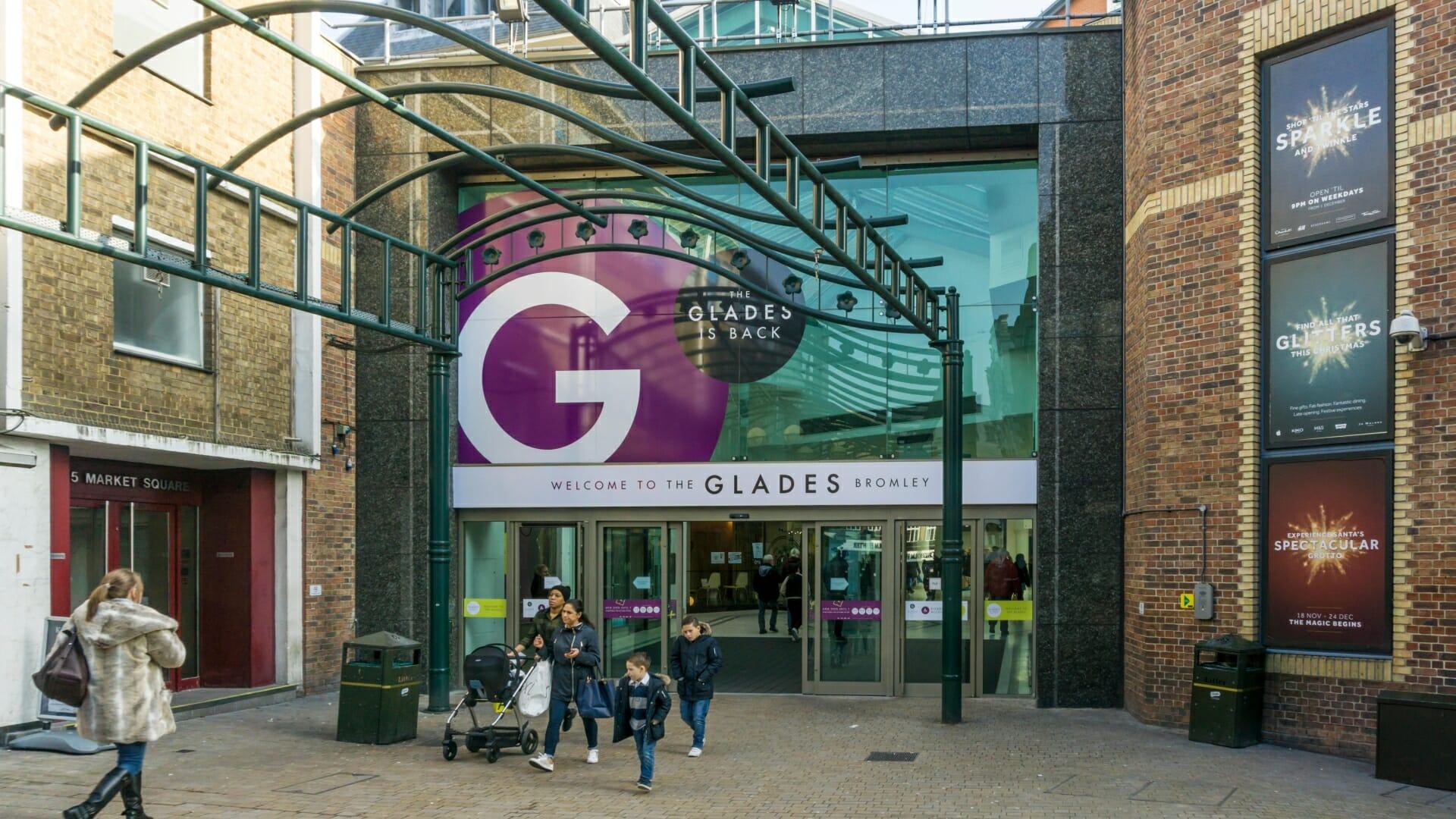 Woman in her 20s 'falls from balcony onto shopper' at The Glades shopping centre as paramedics rush both to hospital