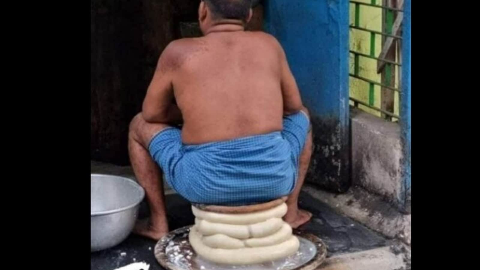 Man sitting atop a stack of paneer shocks Internet. See pic