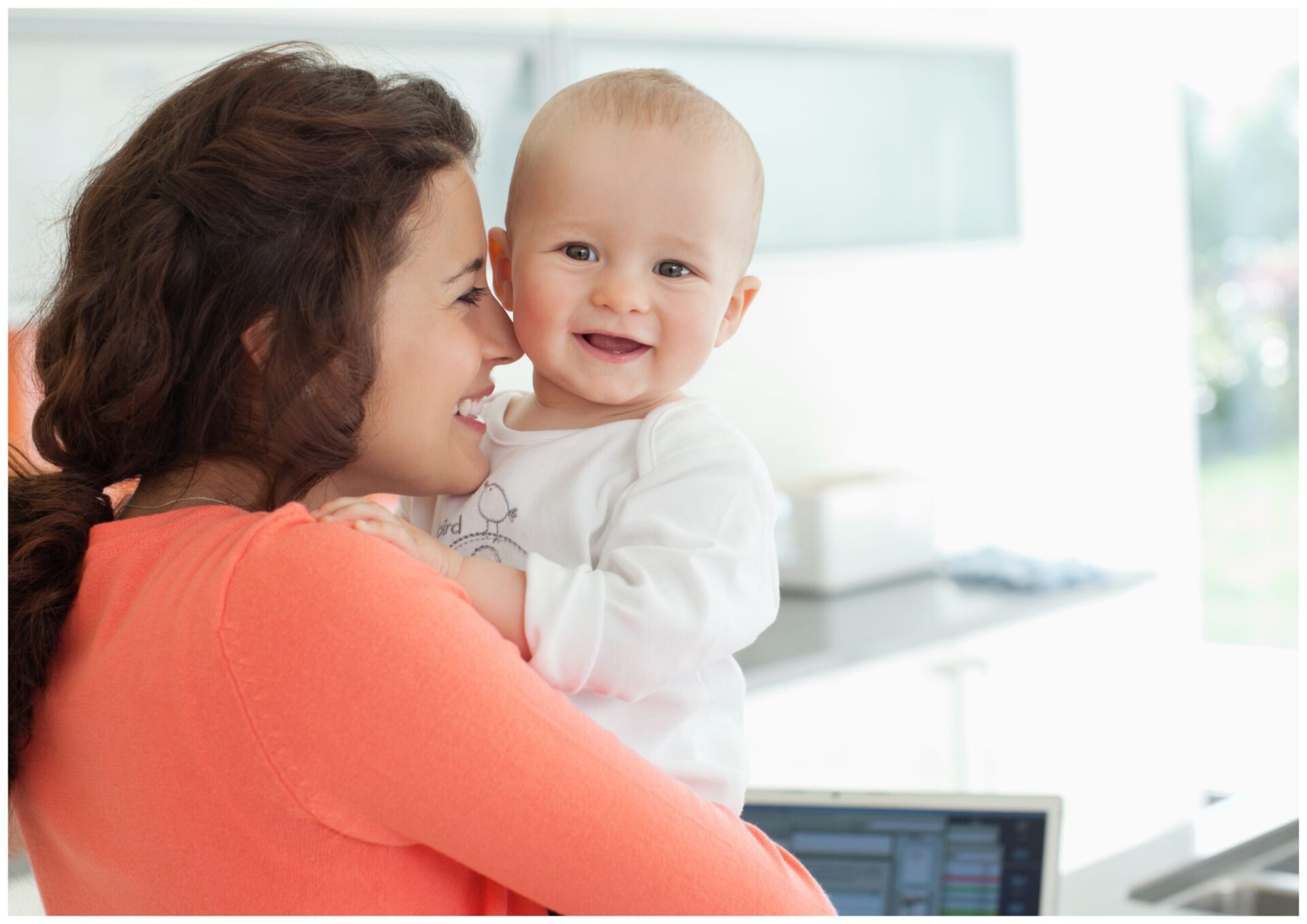 a woman holding a baby