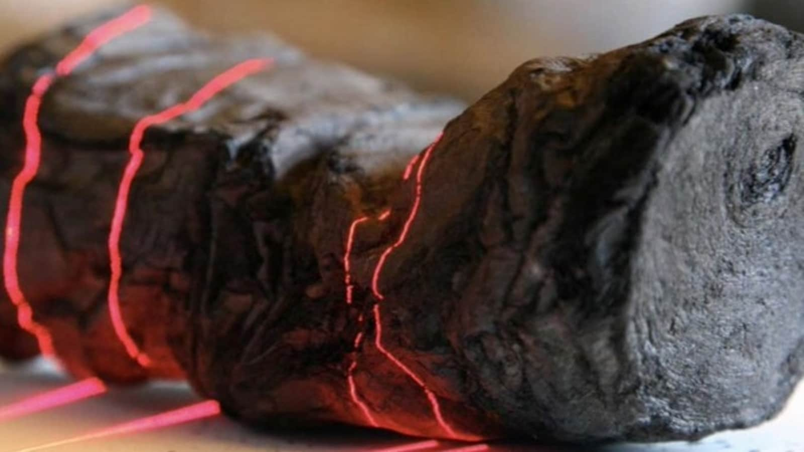 Researchers use AI to read ancient scroll burned by Vesuvius eruption