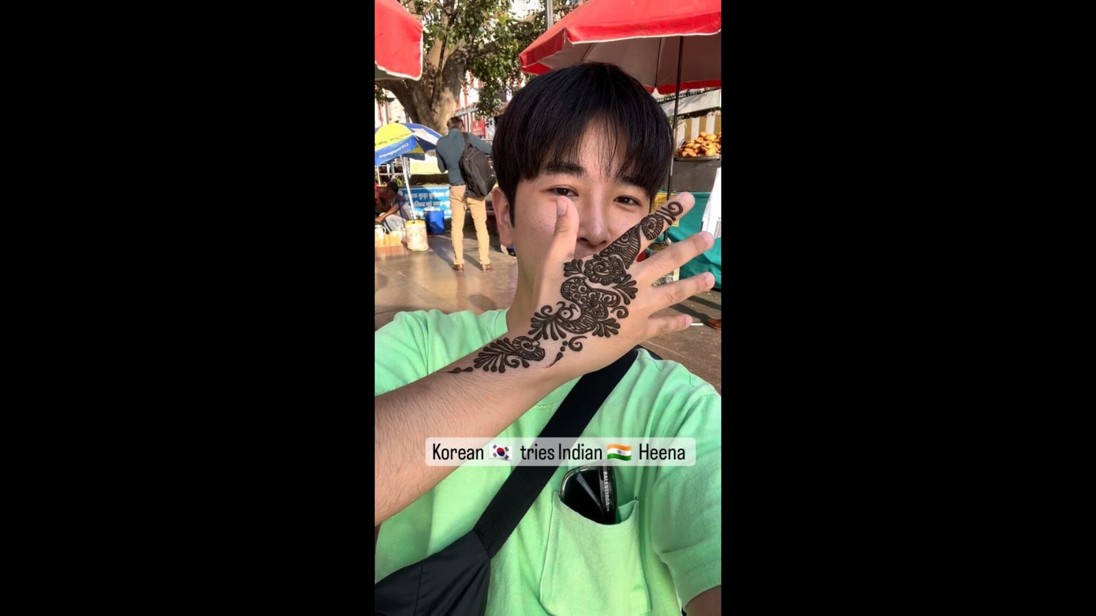 South Korean man shows off mehendi he got while in India. Watch