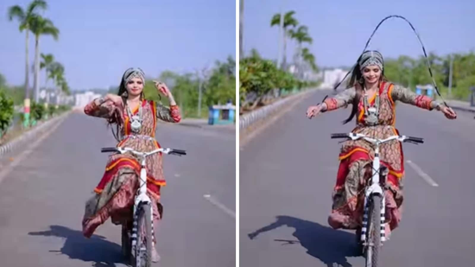 Woman uses skipping rope while riding bicycle, people can’t decide its dangerous or cool